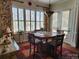 Cozy dining room features lots of natural light from big windows and a chandelier at 86614 Arrington Rd, Lancaster, SC 29720