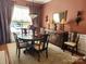 Elegant dining room featuring hardwood floors, and ornate mirror, and custom lighting at 86614 Arrington Rd, Lancaster, SC 29720