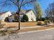Attractive home featuring a well-maintained lawn, mature trees, and an attached garage at 86614 Arrington Rd, Lancaster, SC 29720