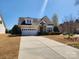 Inviting home with well-kept landscaping, attractive stone accents, and attached garage at 86614 Arrington Rd, Lancaster, SC 29720