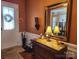 Welcoming foyer featuring a marble-topped chest, decorative mirror, and stylish decor at 86614 Arrington Rd, Lancaster, SC 29720