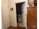 Hallway view leading to a laundry room with a modern washing machine at 86614 Arrington Rd, Lancaster, SC 29720