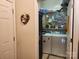 Efficient laundry room with front load machines, ample shelving, and a decorative floral heart at 86614 Arrington Rd, Lancaster, SC 29720