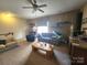 Living room featuring multiple sofas, accent tables, and large windows at 86614 Arrington Rd, Lancaster, SC 29720
