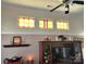 Living room display case with stained glass windows and decor, with hardwood floors at 86614 Arrington Rd, Lancaster, SC 29720