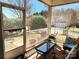 Cozy screened-in porch features comfortable seating and a view of the landscaped backyard at 86614 Arrington Rd, Lancaster, SC 29720