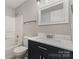 Bathroom with a tub and shower, with a single sink vanity at 9810 Campus Walk Ln # G, Charlotte, NC 28262