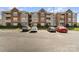 Beautiful condo building exterior with parking, brick accents, and well-maintained landscaping at 9810 Campus Walk Ln # G, Charlotte, NC 28262