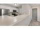 Bright kitchen featuring stainless steel appliances and a convenient breakfast bar at 9810 Campus Walk Ln # G, Charlotte, NC 28262
