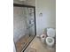 Modern bathroom with a tiled walk-in shower and a white toilet at 1011 Buick Ave, Kannapolis, NC 28083