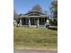 Charming single-story home with a covered front porch and well-maintained lawn at 1011 Buick Ave, Kannapolis, NC 28083