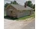 View of a single-story home, featuring gravel landscaping with mature trees at 1011 Buick Ave, Kannapolis, NC 28083