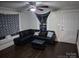 Inviting living room with a comfortable black leather sectional and natural light at 1011 Buick Ave, Kannapolis, NC 28083
