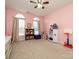 Bright, pink bedroom filled with toys, a bookshelf, and plenty of space for play and imagination at 1021 Glen Laurel Dr, Fort Mill, SC 29707