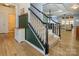 Inviting foyer features wood floors and stairway with a decorative black banister at 1021 Glen Laurel Dr, Fort Mill, SC 29707