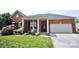 Charming brick home boasts a lush front yard, well-maintained landscaping, and inviting curb appeal at 1021 Glen Laurel Dr, Fort Mill, SC 29707