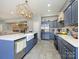 Bright kitchen with stainless steel appliances, a large island and views to the living and dining rooms at 1021 Glen Laurel Dr, Fort Mill, SC 29707