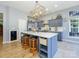 Charming kitchen featuring a spacious island with seating, stainless appliances, and stylish decor at 1021 Glen Laurel Dr, Fort Mill, SC 29707