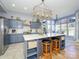 Modern kitchen features a large island, stainless steel appliances, and lots of natural light at 1021 Glen Laurel Dr, Fort Mill, SC 29707