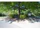 A public outdoor park featuring shady trees, benches, and a little free library at 1021 Glen Laurel Dr, Fort Mill, SC 29707