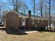 Brick home's backyard features a spacious layout with patio, perfect for outdoor activities at 10607 Wood Meadow Dr, Charlotte, NC 28227