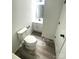Small, updated bathroom with modern toilet and vanity with solid surface top at 10607 Wood Meadow Dr, Charlotte, NC 28227