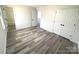 Neutral bedroom features closet with sliding doors and neutral walls and flooring at 10607 Wood Meadow Dr, Charlotte, NC 28227