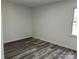 Bedroom featuring neutral walls and flooring and a window allowing plenty of natural light at 10607 Wood Meadow Dr, Charlotte, NC 28227