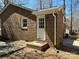 Charming brick home exterior featuring a well-maintained entrance and mature landscaping at 10607 Wood Meadow Dr, Charlotte, NC 28227