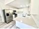 Remodeled kitchen with stainless steel appliances and white cabinets at 10607 Wood Meadow Dr, Charlotte, NC 28227