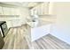 Bright kitchen with white cabinets, quartz countertops, and stainless steel appliances at 10607 Wood Meadow Dr, Charlotte, NC 28227