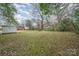This home features a generously-sized backyard with mature trees and a storage shed at 108 White Oak St, Chester, SC 29706