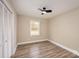 This simple bedroom features wood-look floors, a ceiling fan, and a convenient closet at 108 White Oak St, Chester, SC 29706