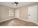 Bedroom featuring wood-look vinyl floors, natural lighting, a closet and ceiling fan at 108 White Oak St, Chester, SC 29706