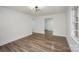 A bright and airy living room featuring newly installed floors, fresh paint, and modern lighting at 108 White Oak St, Chester, SC 29706