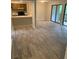 Spacious open living room and kitchen area with access to a deck through sliding glass doors at 11022 Harrowfield Rd, Charlotte, NC 28226