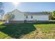 Backyard features siding, brick foundation, and green grass at 121 Wichita Dr, Shelby, NC 28152