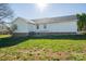 Backyard with siding, brick foundation, and grassy yard at 121 Wichita Dr, Shelby, NC 28152