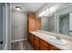A bathroom features a double vanity, large mirror, and shower-tub combo at 121 Wichita Dr, Shelby, NC 28152