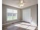 Well-lit bedroom featuring hardwood flooring, a ceiling fan, and closet with natural light at 121 Wichita Dr, Shelby, NC 28152