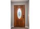A wooden front door featuring an oval glass insert and stylish hardware adds charm to the entry at 121 Wichita Dr, Shelby, NC 28152