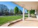 Covered porch with stately columns, brick accents, and a view of the green front yard at 121 Wichita Dr, Shelby, NC 28152