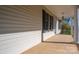 Spacious covered porch with white siding, black shutters, and classic architectural details at 121 Wichita Dr, Shelby, NC 28152
