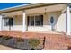 Covered front porch with brick foundation and classic columns at 121 Wichita Dr, Shelby, NC 28152
