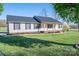 Traditional home boasting black shuttered windows, green lawn, and charming curb appeal at 121 Wichita Dr, Shelby, NC 28152