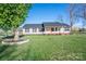 Inviting single-story home with a beautiful lawn and a classic front porch design at 121 Wichita Dr, Shelby, NC 28152