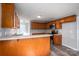 A bright kitchen offers ample wood cabinets, stainless appliances, and a convenient breakfast bar at 121 Wichita Dr, Shelby, NC 28152