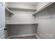 A walk-in closet has built-in shelving for organization and storage at 121 Wichita Dr, Shelby, NC 28152