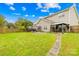 Spacious backyard with a well-maintained lawn, patio, and fenced perimeter offers privacy at 13521 Michael Lynn Rd, Charlotte, NC 28278