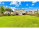 A spacious backyard with a green lawn and privacy fence provides ample space at 13521 Michael Lynn Rd, Charlotte, NC 28278